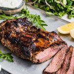 Butterflied lamb leg served with a rocket and cucumber salad